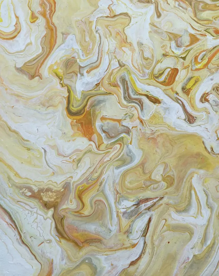Cream, white, and soft gold marbling like polished alabaster.