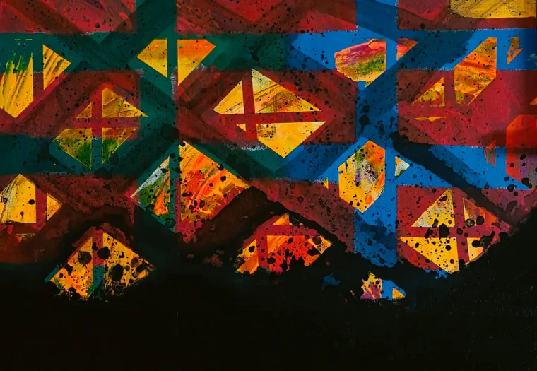 A geometric painting of interlocking triangles and diamonds in crimson, teal, cobalt blue and luminous orange-gold, flecked all over with black spatter, the whole tessellation dissolving into solid black across the lower third of the canvas.