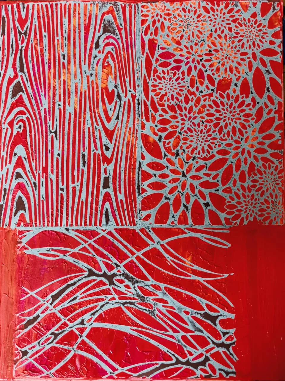 A vermilion-red canvas divided into three panels of raised white line-pattern: at top left the whorled grain of cut wood, at top right a field of chrysanthemum rosettes, and across the bottom a sweeping fan of branching veins, all standing proud of a crackled red and dark ground.