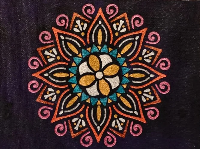 A radial floral mandala in orange, pink, teal, and gold on a deep indigo ground.