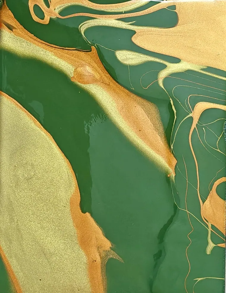 Emerald green and metallic gold marbled into stone-like veins.