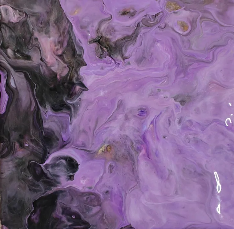 A glossy acrylic pour: pale lilac veined with gold meeting a deep charcoal-black void.